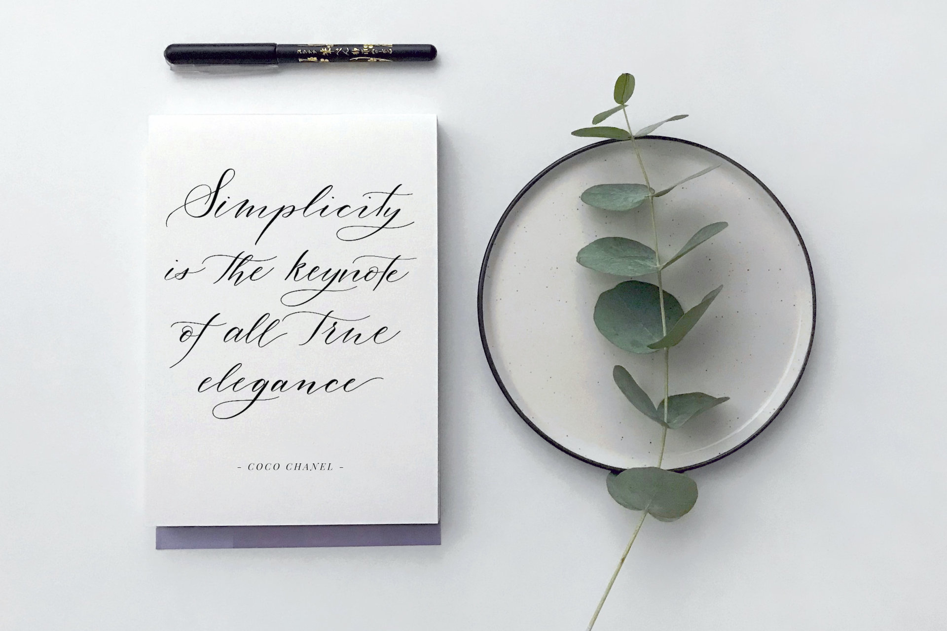 Flatlay arrangement with writing pad.